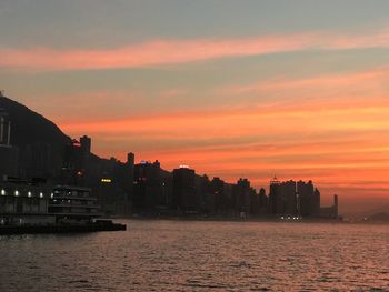Scenic view of sea against romantic sky at sunset