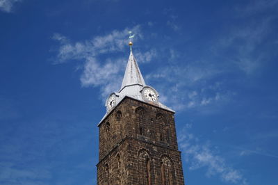 Low angle view of clock tower against sky