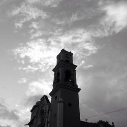 Low angle view of clock tower against sky