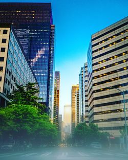 Low angle view of modern buildings against clear sky