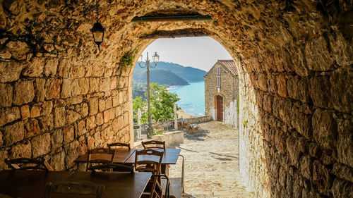 Buildings seen through arch window