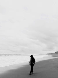 The girl walking on beach