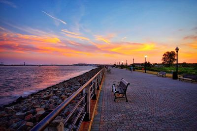 Scenic view of beach against sky during sunset