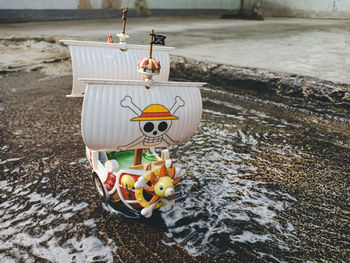 Close-up of stuffed toy on shore