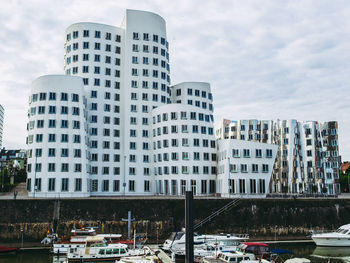 View of buildings in city against sky