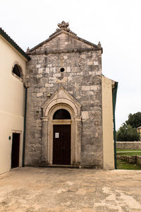 Exterior of historic building against sky