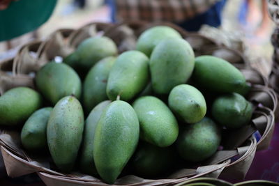 Close-up of fruits in basket at market stall