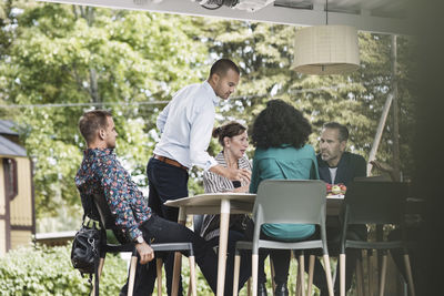 Business people discussing in portable office truck