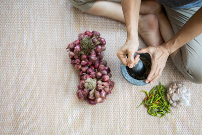 High angle view of hand holding fruit
