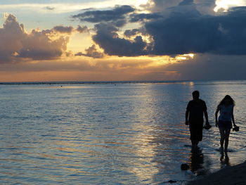 Scenic view of sea at sunset