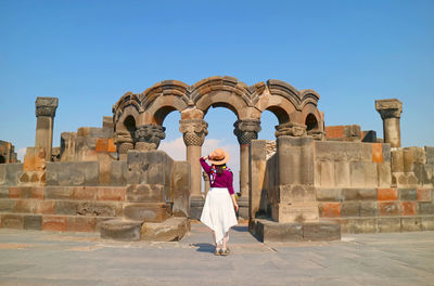 Female visitor at the amazing zvartnots cathedral in armavir province of armenia