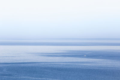 View of calm blue sea against clear sky