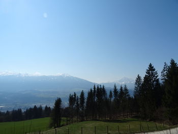 Scenic view of mountains against clear blue sky