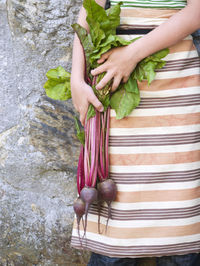 Girl holding beetroots