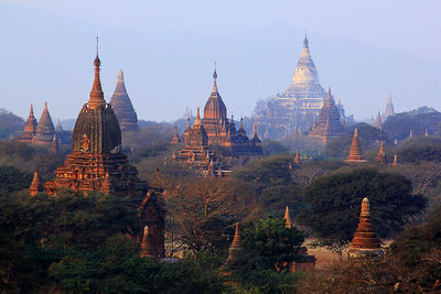 Panoramic view of temple and building against sky