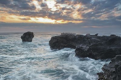 Scenic view of sea against cloudy sky