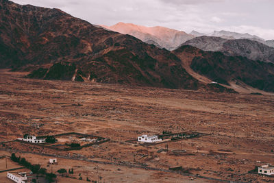 High angle view of road by mountain against sky