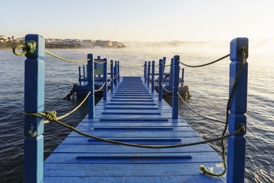 Pier over sea against sky