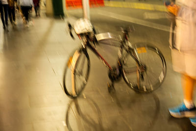 Blurred motion of bicycle on road