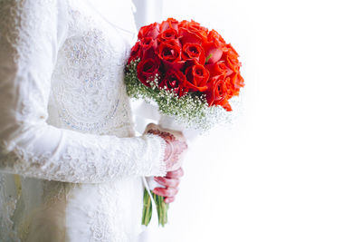 Close-up of rose bouquet against white background