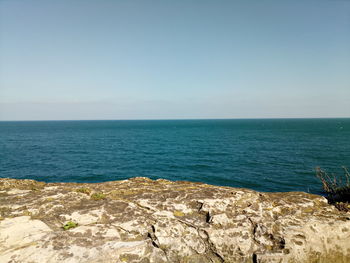 Scenic view of sea against clear sky