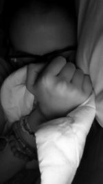 Close-up of baby sleeping on bed