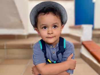 Portrait of boy looking away while standing outdoors