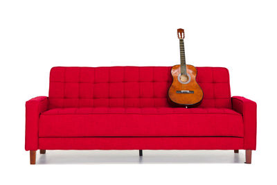 Red sofa against white background