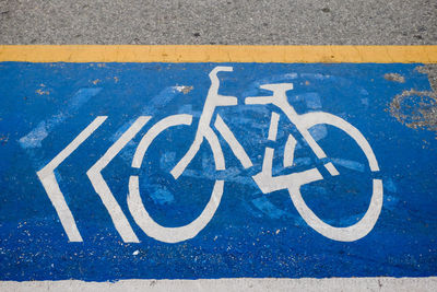 High angle view of road sign on street