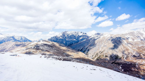 Scenic view of snowcapped mountains against sky