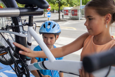 Rear view of woman sitting on wheelchair