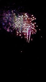 Close-up of illuminated fireworks against black background