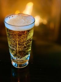Close-up of beer glass on table