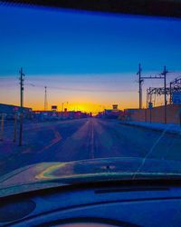 Road against sky seen through car windshield