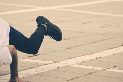 Low section of man relaxing on floor