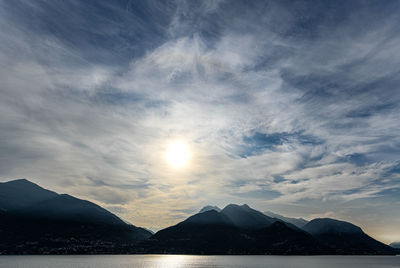 Scenic view of snowcapped mountains against sky during sunset