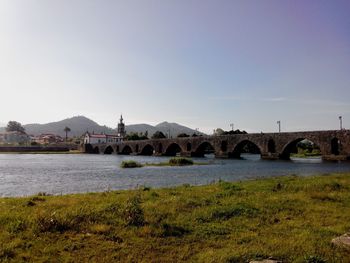 Bridge over river against clear sky