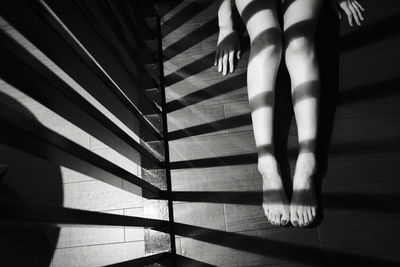 Low section of woman standing on floor