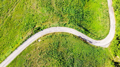 High angle view of road amidst field