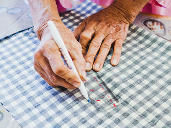 High angle view of man working on table