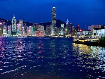 Illuminated buildings in city at night