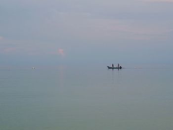 Sailboat in sea against sky