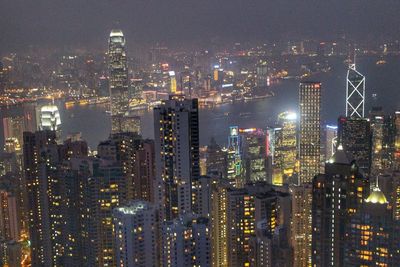 Illuminated victoria harbour at night