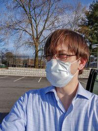 Portrait of mid adult man against blue sky