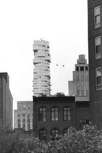 Low angle view of skyscrapers against sky