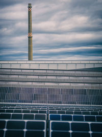 High angle view of solar panels against cloudy sky