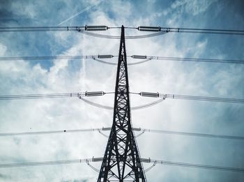 Low angle view of electricity pylon against sky