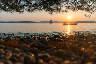 Scenic view of sea against sky during sunset