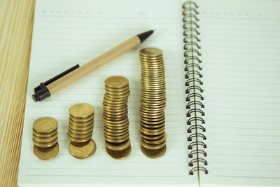 High angle view of coins on table