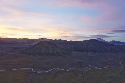 Scenic view of mountains against sky during sunset